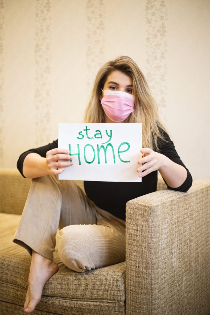 Girl with the poster Stay Home